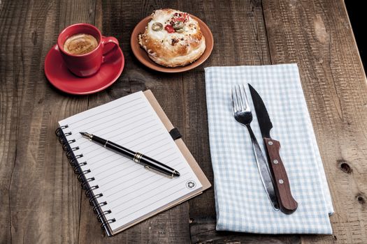 Coffe,pen and paper and some food