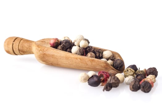 Black Pepper on Wood Spoon Isolated on White Background