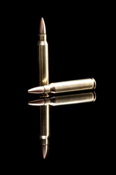 Bullets isolated on black background with reflexion