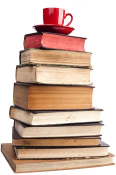 Old Books  and red coffee mug isolated on white background