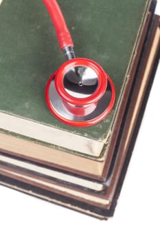 Old Books Red Stethoscope Isolated on White Background