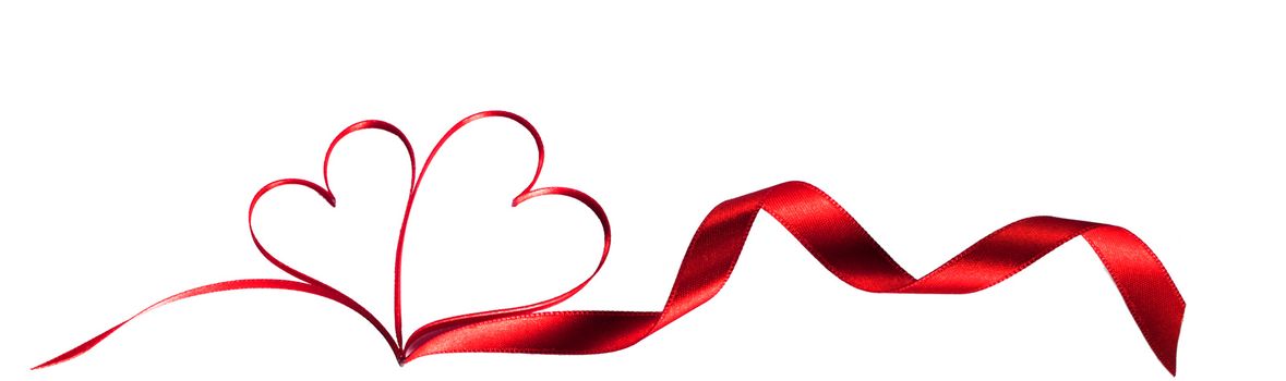 Red ribbons in shape of two hearts for love concept, wedding or Valentine day isolated on white background