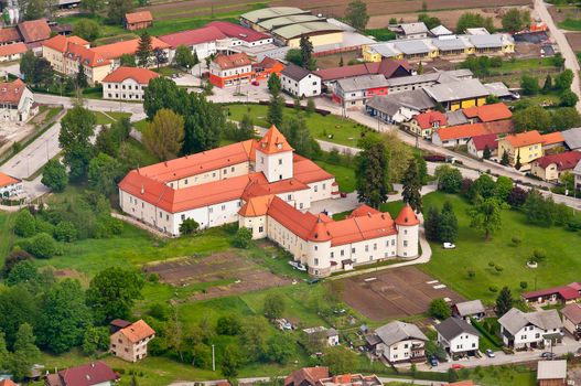 Medieval castle in European village, municipality Race Fram in Slovenia, aerial view, lower Styria near Maribor