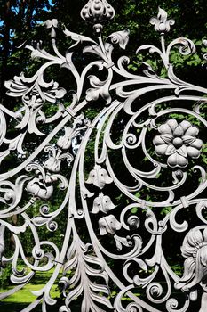 Nice ancient iron fence with floral decor. St. Petersburg, Russia