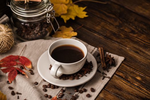 Autumn Cup of Coffee. Yellow leaves and Jar Coffee Beens