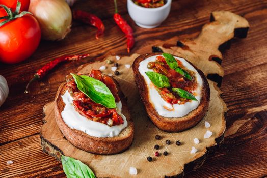 Two Bruschettas with Sundried Tomatoes and Spicy Sauce with Red Pepper