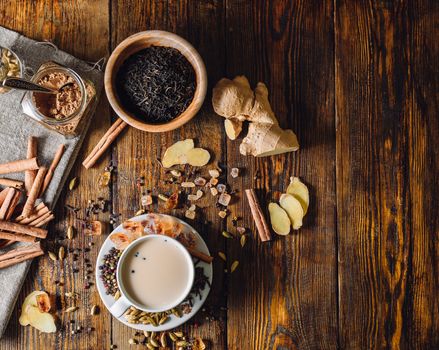 Ingredients for Masala Chai and Cup with Beverage. View from Above and Place for Text.