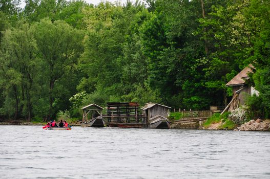 Eaftin of river with unique traditional boat mill on a river, Mura river in Slovenia with famous landmark, rural travel concept, rare heritage of Europe