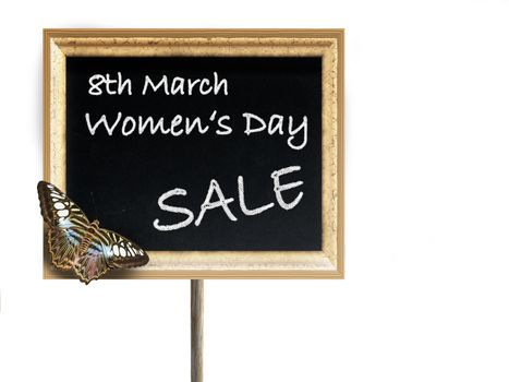 Black chalkboard with golden frame and text 8th March Women's Day SALE and butterfly