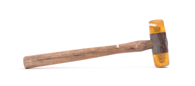 Old wooden hammer isolated on a white background