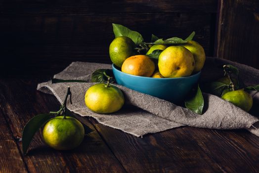 Still Life with Tangerines in Blue Bowl. Selective Focus on Tangerines in Bowl