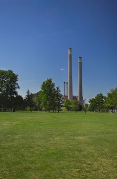 two large chimney at the end of a park