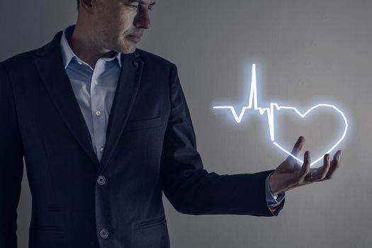 Picture of man holding a lightning heart