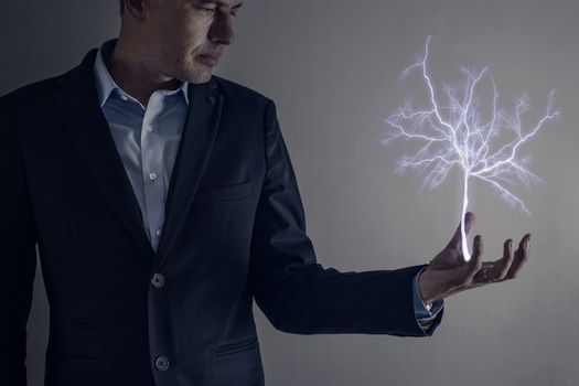 Picture of man holding a lightning strike tree