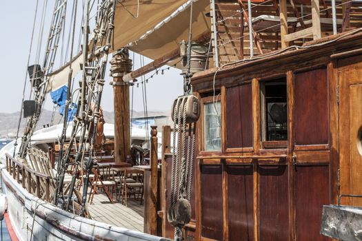 Old vintage looking wood ship on water