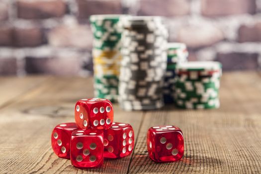 Bright Red Dice on brown wood table