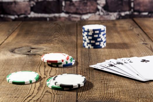 Cards and chips on brown wood table