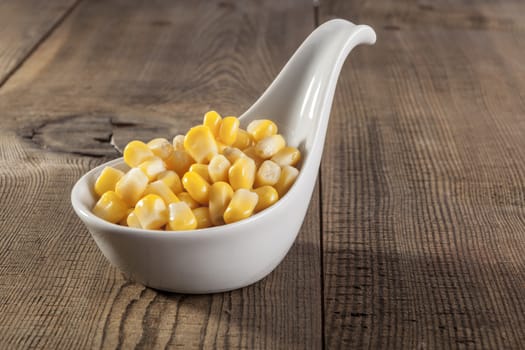 Sweet yellow corn beans on wood table