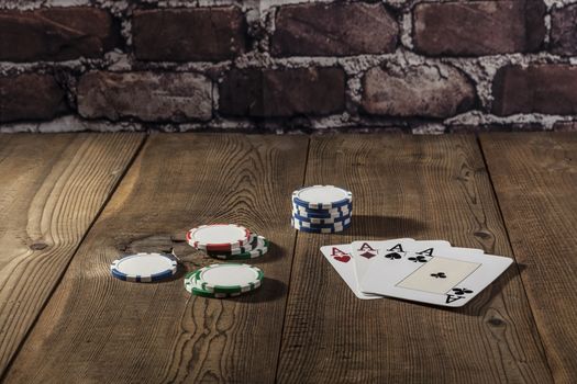 Cards and chips on brown wood table