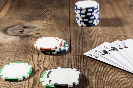 Chips and cards on brown wood table