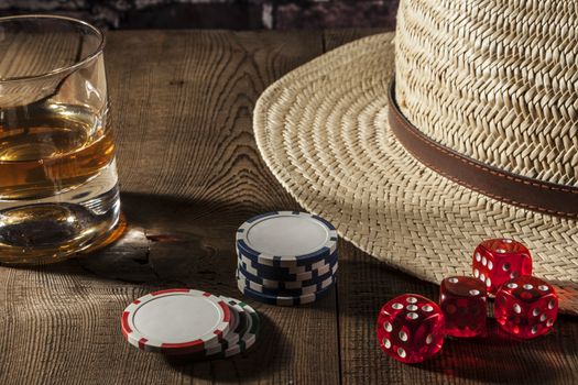 Dice and chips on brown wood table