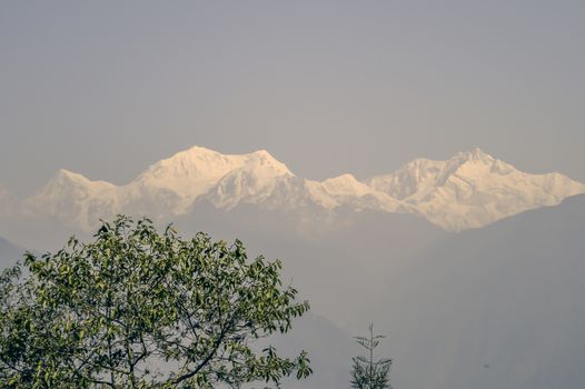 Beautiful view of White snowy tops of Himalayan mountain range in morning. ( Kanchanjungha range from dzongri pass sikkim near Pelling Helipad) Its a popular tourist destination place of north India.