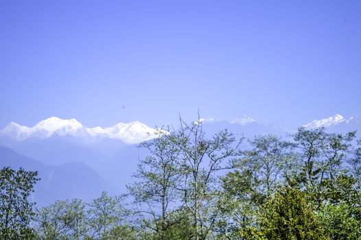 Beautiful view of White snowy tops of Himalayan mountain range in morning. ( Kanchanjungha range from dzongri pass sikkim near Pelling Helipad) Its a popular tourist destination place of north India.