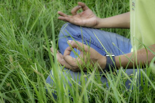 Close up hands, yoga outdoor, exercising vital and meditation for fitness at the nature background. Healthy and Yoga, zen relaxation nature background. Healthy Lifestyle Concept. (Kolkata, India)