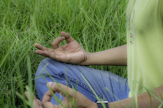 Close up hands, yoga outdoor, exercising vital and meditation for fitness at the nature background. Healthy and Yoga, zen relaxation nature background. Healthy Lifestyle Concept. (Kolkata, India)