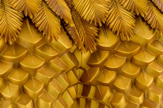 Abstract seamless geometrical wavy background from golden metal shaped and banners with ethnic patterns. Art decor wallpaper style of the tropics. Palm leaves of tropical plant creative composition