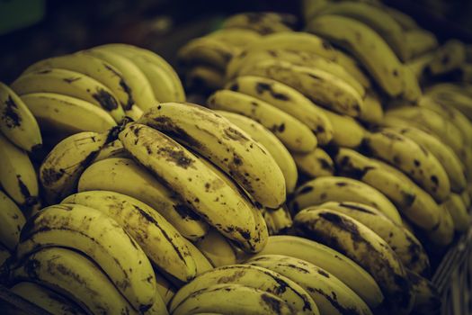 Ripe bananas on a market, detail of a tropical fruit in a shop in town