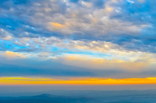 Vibrant color cloud scape on a dramatic sky. Image was captured on a sunny summer day in sunset time. Outdoor travel photography. (Hill station of Darjeeling, West Bengal, India)