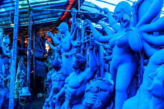 Handmade clay model of "Maa Durga" or " Devi Durga"- Hindu woman Idol. Snapped in the beginning of city famous Bengali festival of Kolkata or Calcutta, West Bengal, India, Asia