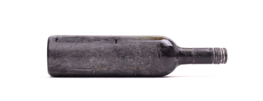 Old bottle of wine, covered in dust, isolated on white