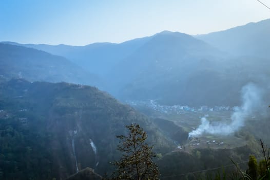 In the jungle to top mountains. Aerial, panoramic view of a forest in the mountains on a foggy day with copy space. Manali, Himachal Pradesh, India