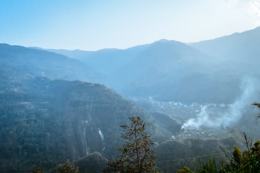 In the jungle to top mountains. Aerial, panoramic view of a forest in the mountains on a foggy day with copy space. Manali, Himachal Pradesh, India