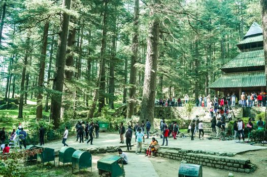 MANALI, INDIA - DECEMBER 9 Tourist come See the sacred Hidimda Devi Temple in Shimla, Kullu, Himachal Pradesh, noerthern India, Asia. Famous view of wooden covered architecture of Himalayan region.