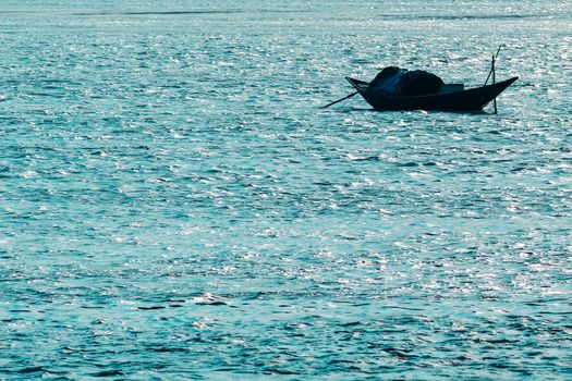 View of Clean flowing blue water surface with ripples and sunrays or sunlight reflections. Beautiful Adriatic Sea water shines at dusk light.Natural beauty Wave water texture design for background.