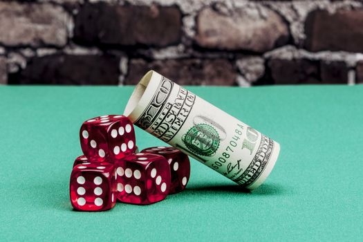 Dollar and dice on green table with shadow