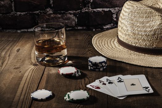 Hat and cards on brown wood table