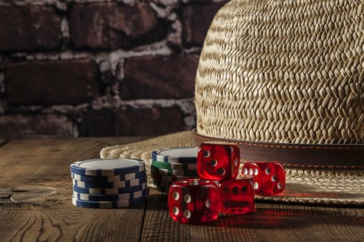 Hand and dice on brown wood table