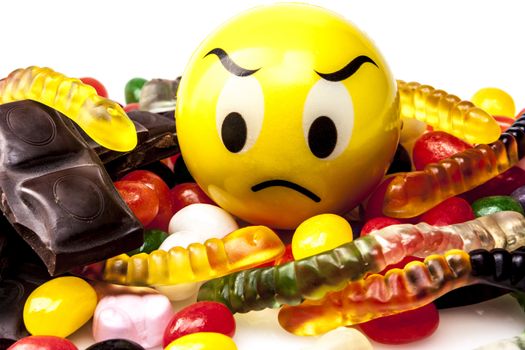 Sweets isolated on white background and big emoticon