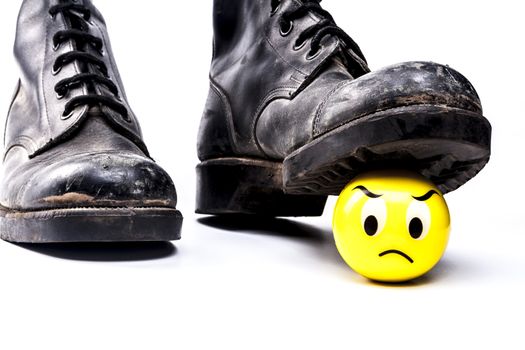 Army boots and emoticon isolated on white background with shadow