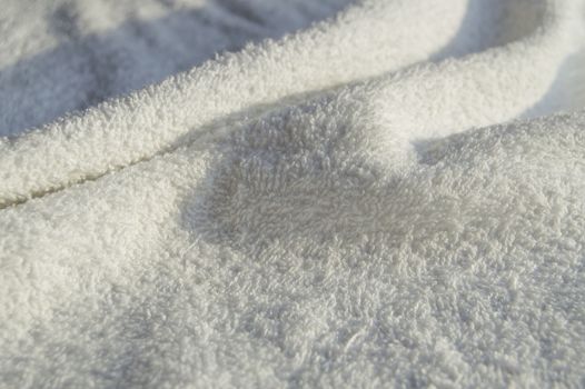 White Terry soft towel for SPA treatments, texture, background.