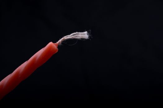 Colorful candle  on a black background