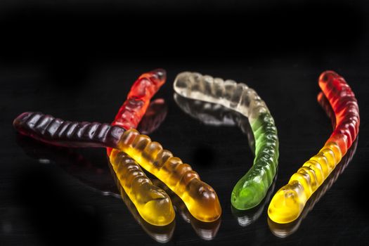 Jelly isolated on black background with reflexion
