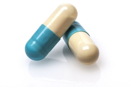 Pair of Blue pills capsule isolated on white background