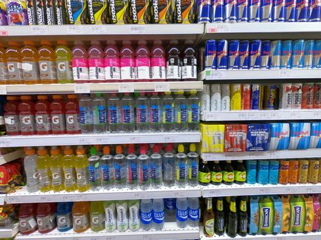 Energy Drink, Vitamin Water, Red Bull Cans in Supermarket