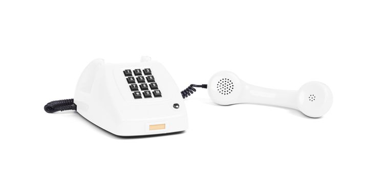 Vintage white telephone with a white background