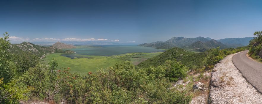 Panoramic view from above of Skadar lake and Crnojevica river in a national park, Montenegro, in a sunny summer day